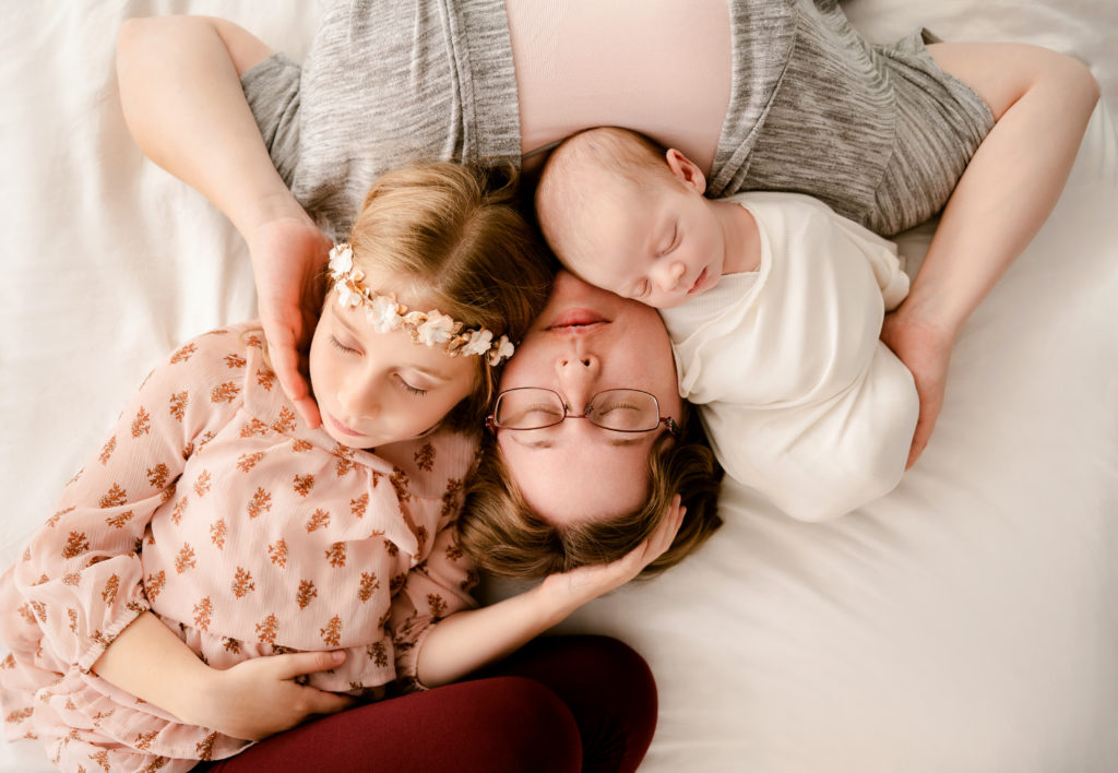 Family and Siblings with Baby from above | Newborn Portrait Photographer in Princeton MN